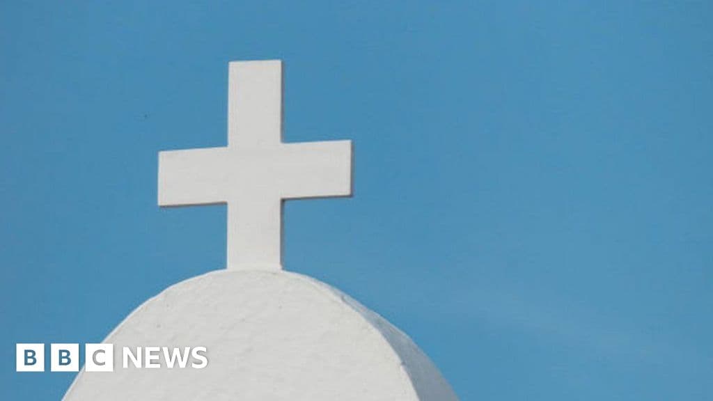A gritty, cynical political cartoon style illustration. In the foreground, a Nigerian police officer with a blindfold on is standing in front of an empty church, holding a megaphone and shouting 'Nothing is happening,' while in the background, a long line of shadowy figures is being led away into a dark, thorny forest. The sky is a bruised purple and orange, and the ground is littered with discarded prayer books and official-looking folders labeled 'DENIALS.'