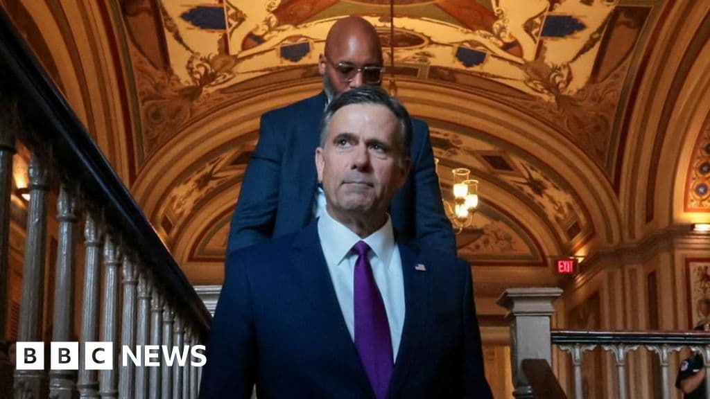A satirical, high-contrast digital painting of a shadowy figure in a tailored suit (representing the CIA) sitting across from a blurred, gold-bedecked leader in a dark Caracas office. On the table between them is a map of South America being used as a coaster for an oil drum-shaped coffee mug. Through the window, the Venezuelan flag is visible, but the stars are replaced by tiny corporate logos. The lighting is cinematic, cold, and oppressive, emphasizing a sense of backroom deals and cynical power.
