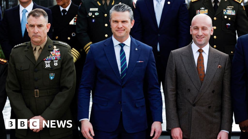 A conceptual illustration in a satirical, gritty editorial style. On one side, a rusty, hulking, bureaucratic robot representing the Pentagon, covered in red tape and holding a rubber stamp that says 'REJECT'. On the other side, a sleek, fragile, glass-like humanoid figure representing Silicon Valley AI, looking shocked and holding a lawsuit paper. They are standing in a crumbling courtroom. The lighting is dim and dramatic. Muted colors, cynical atmosphere.