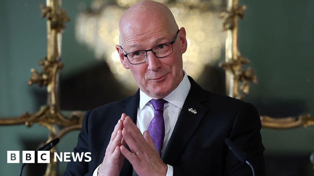 A satirical oil painting of the Scottish Parliament building at Holyrood, depicted as a crumbling, oversized child's playpen. Inside, small, grey-faced politicians in red, yellow, and blue suits are fighting over a broken toy ferry boat while a cold, grey rain falls from a leaden sky. In the background, a crowd of ghostly, bored-looking citizens is walking away into a thick mist. Cinematic lighting, dismal and cynical atmosphere.