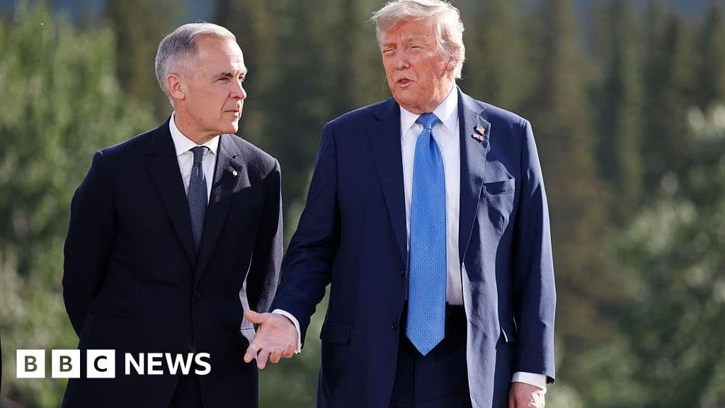 A satirical illustration showing a giant, angry orange wall slamming down on a small, polite beaver holding a bottle of maple syrup. The scene is set on a map of North America, with red warning signs and dollar symbols floating in the air.