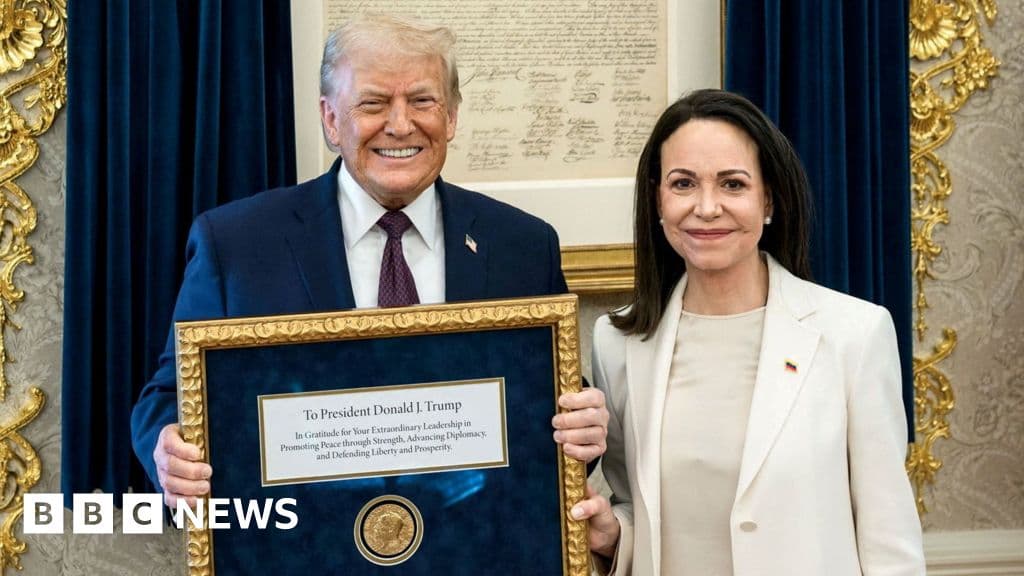 An acid-drenched satirical illustration of a gold Nobel Peace Prize medal sitting on a velvet cushion inside a golden birdcage at Mar-a-Lago. In the reflection of the medal, two distorted, smiling political figures shake hands while a background of Venezuelan oil fields burns in a sickly neon green. The style is sharp, cynical caricature with excessive gold leaf and dark shadows.