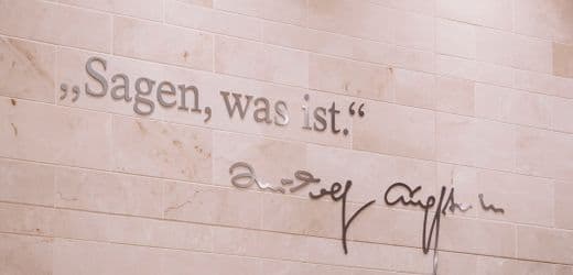 A hyper-realistic, cynical oil painting of a group of elderly journalists in tuxedos, sitting in a glass tower, holding giant silver ear trumpets to the floor while a chaotic, faceless mob screams below them. The lighting is cold and clinical. In the center, a professor in a tweed suit is measuring the sound waves with a golden ruler, looking bored.