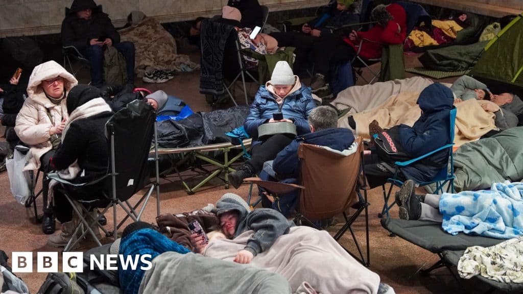 A moody, cynical illustration of a shattered lightbulb lying on cold concrete, with a dark, powerless city skyline in the background under a gloomy sky.