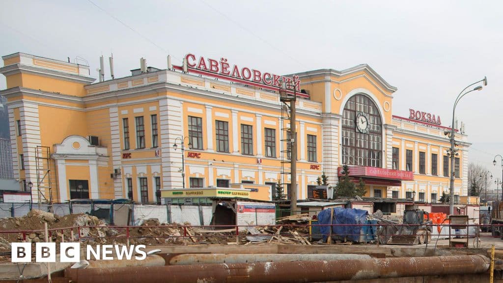 A gritty, moody illustration of a Moscow railway station aftermath, police tape in the foreground, blurred figures of security personnel in heavy coats, grey winter atmosphere, shattered glass on the pavement, cinematic lighting, high contrast.