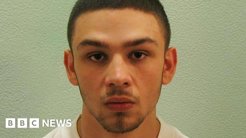 A hyper-realistic, cynical depiction of a British politician in a tailored suit standing in front of a crumbling, moss-covered prison wall. He is holding a massive, shiny iron padlock that is not actually attached to the rusted, wide-open gate behind him. The atmosphere is cold, gray, and damp, evoking a sense of bureaucratic decay and performative futility.