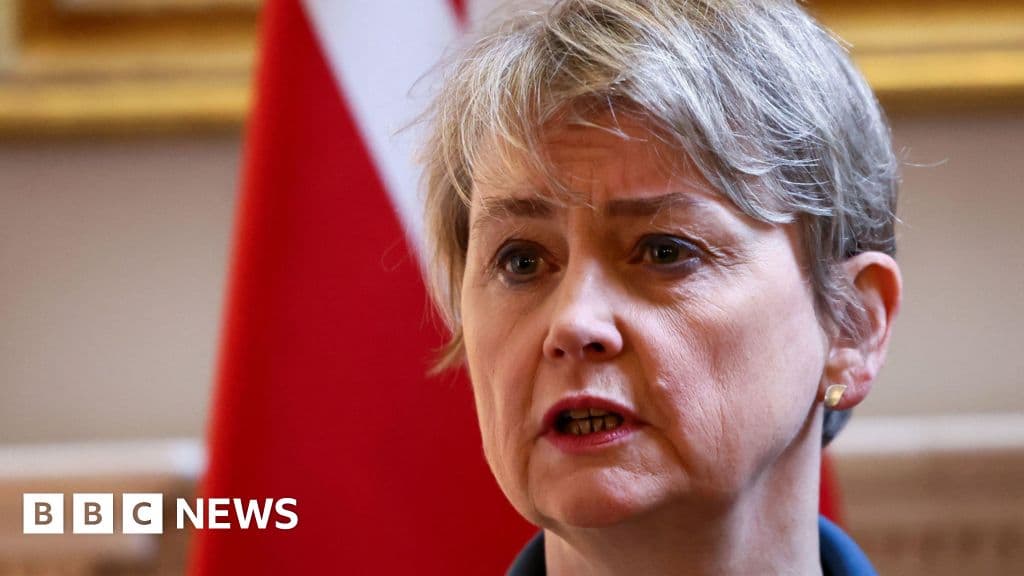 A hyper-realistic, satirical oil painting of a gloomy, ornate boardroom table sitting in the middle of a muddy, cratered battlefield. At the head of the table is an empty golden chair. Around the table are nervous bureaucrats in grey suits, looking at their watches and holding stacks of paperwork, ignoring the smoke and ruin in the background. The lighting is dramatic and moody, reminiscent of a Caravaggio painting but with modern corporate decay.