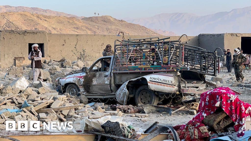A gritty, monochromatic illustration of a rugged border landscape with smoke rising in the distance, viewed through a cracked window frame, symbolizing broken relations and destruction.