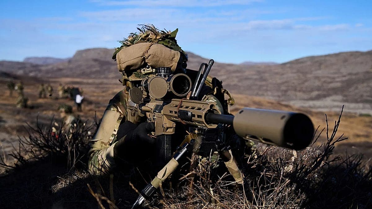 A hyper-realistic, cynical digital painting of a melting Greenland landscape. In the foreground, a tiny French soldier in a crisp, impractical uniform stands next to a massive, gaudy 'Trump Greenland' real estate sign. In the background, a NATO jet flies over a collapsing glacier. The lighting is cold, harsh, and unforgiving.