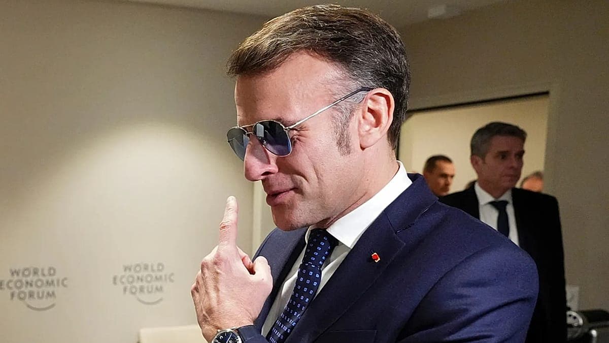 A hyper-realistic, satirical painting of Emmanuel Macron wearing oversized, shimmering aviator sunglasses that reflect a melting Greenland, while a caricature of Donald Trump stands in the background holding a giant gold-plated 'SOLD' sign over a map of Europe, set against the snowy, elitist backdrop of the Davos summit.