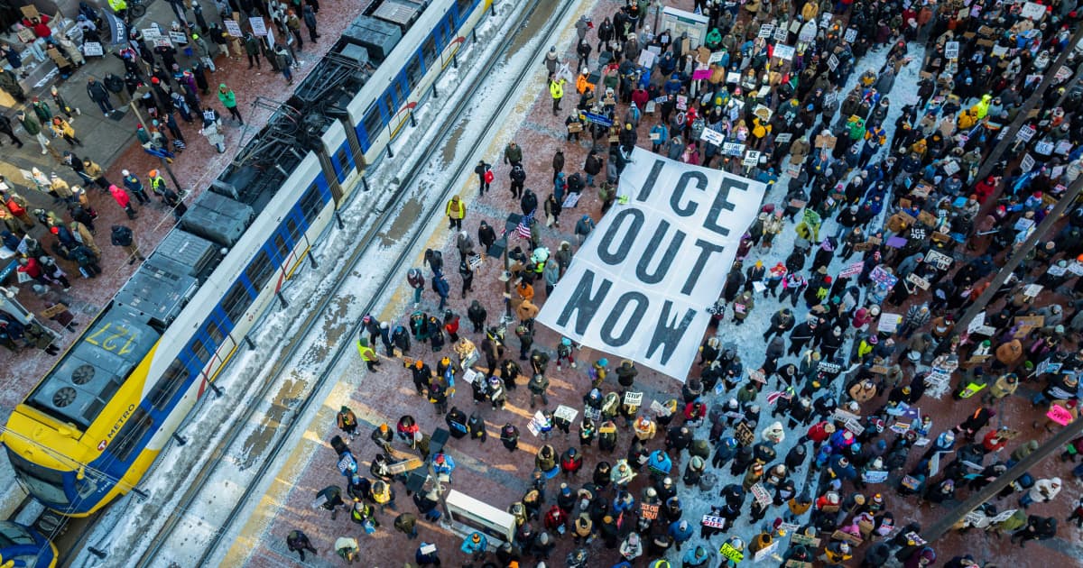 A hyper-realistic, gritty courtroom sketch style image. A tired lawyer in a suit slumping over a table with piles of messy paperwork, holding her head in her hands. The background is a blurry, gray federal courtroom with an indifferent judge looking down. The lighting is dim and depressing, capturing a mood of exhaustion and bureaucracy.