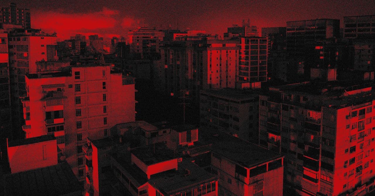 A gritty, hyper-realistic digital art piece showing a split screen: on one side, a darkened, crumbling Caracas skyline under a stormy sky; on the other side, a sterile, blue-lit office where a faceless ICE agent stares at a tablet showing a complex algorithmic map of a suburb. The middle is bisected by a glowing, jagged digital line representing a power surge.