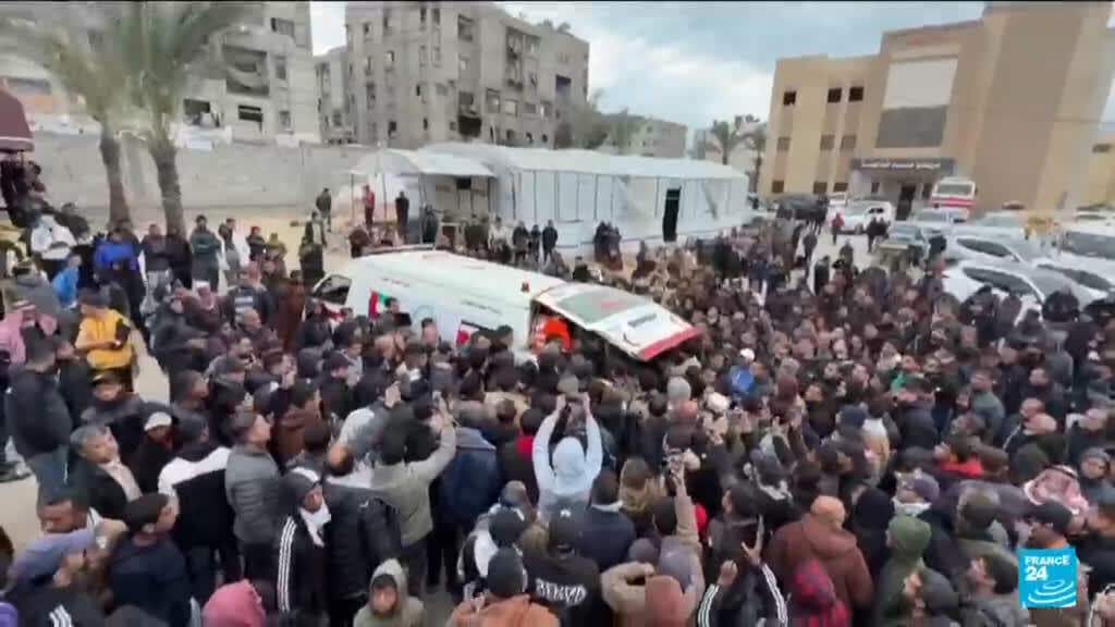 A hyper-realistic, black and white photograph of a broken camera lens lying in the dust, reflecting a desolate landscape of rubble. In the background, a faded, tattered sign that reads 'PRESS' is barely visible. The lighting is harsh and high-contrast, evoking a sense of cynical noir and abandoned truth.
