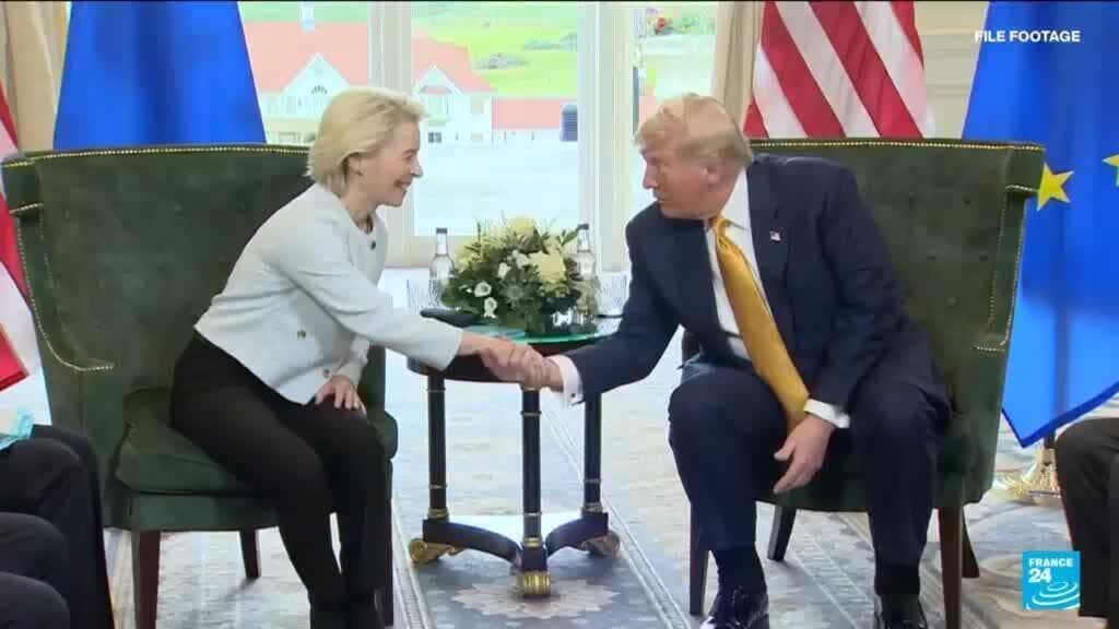 A cynical, dark oil painting depicting Ursula von der Leyen and a generic American politician shaking hands over a map of Greenland. Their hands are made of melting ice, and the background features a burning European Parliament building filled with shredded trade documents. The style is acid-drenched and satirical, with a bored, exhausted atmosphere.