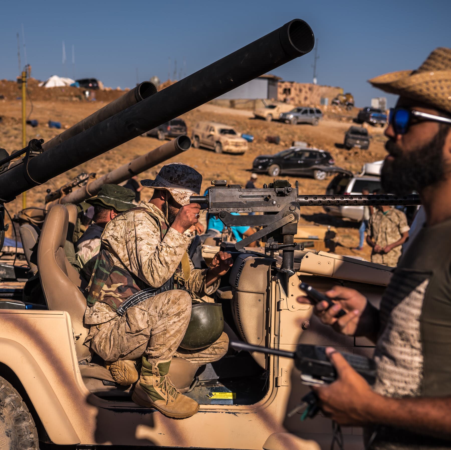 A gritty, high-contrast satirical collage. On the left, a crumbling Venezuelan oil derrick dripping black sludge that turns into gold coins. On the right, a shadowed figure in military fatigues catching the coins in a briefcase. In the background, a faded Venezuelan flag merging with a digital stock market ticker tape showing red arrows pointing down. The atmosphere is smoky, cynical, and dark.