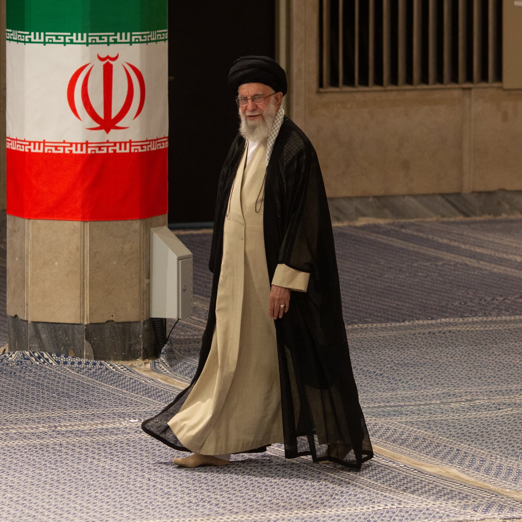 A photorealistic, high-contrast news photo of Ayatollah Ali Khamenei sitting at an ornate desk. He is looking pensive and holding a pen, hovering over a flowchart. The flowchart has multiple starting boxes labeled 'Protests,' 'Economic Crisis,' and 'International Sanctions,' but every single arrow leads to one large, red central circle labeled 'CRUSH THEM.' The lighting is dramatic and serious.