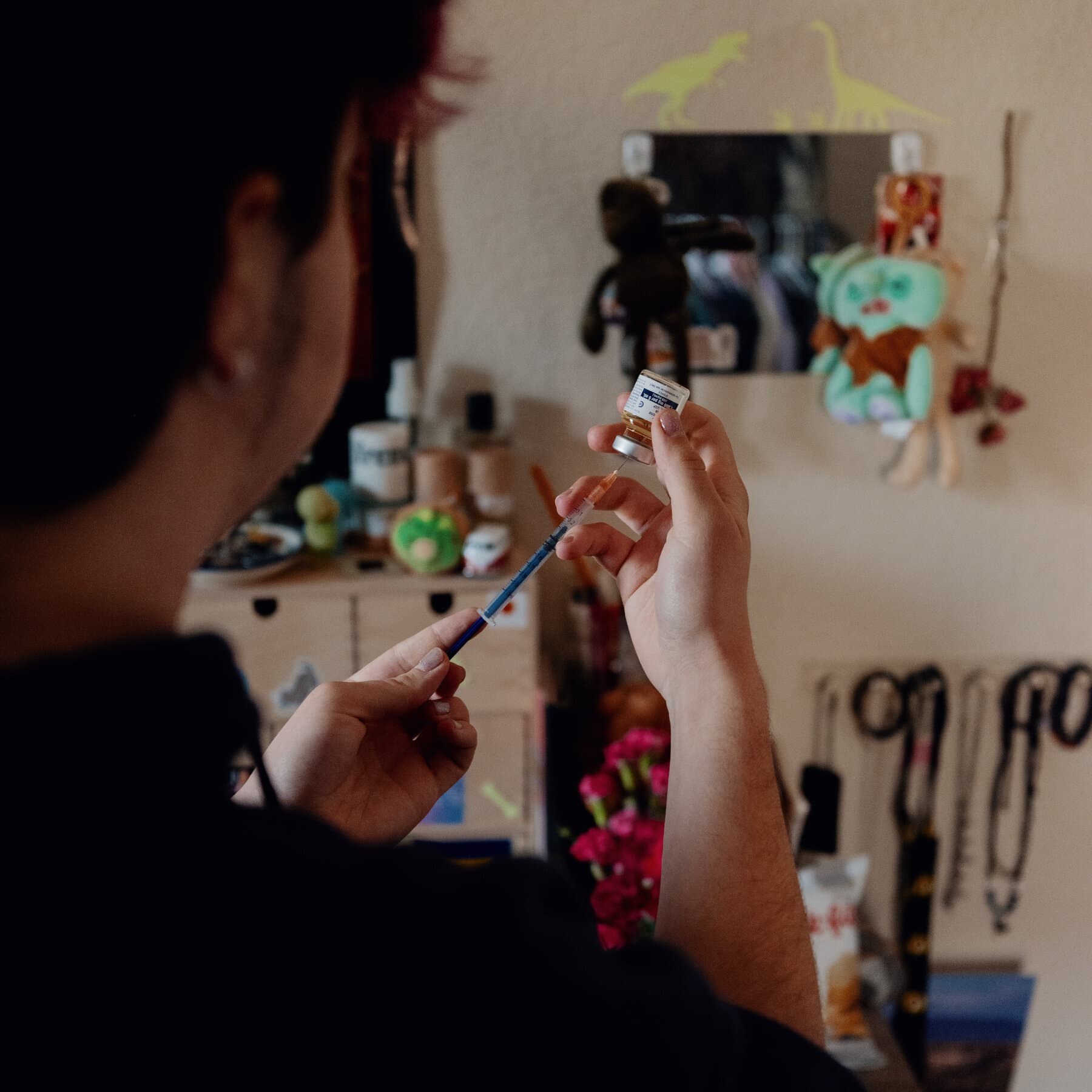 A hyper-realistic, desaturated editorial illustration of a massive, decaying concrete government building casting a long, oppressive shadow over a small, fragile glass hospital in the Colorado mountains. The shadow is shaped like a gavel. The sky is an ominous, bruised purple. No people, just the crushing architecture of bureaucracy.
