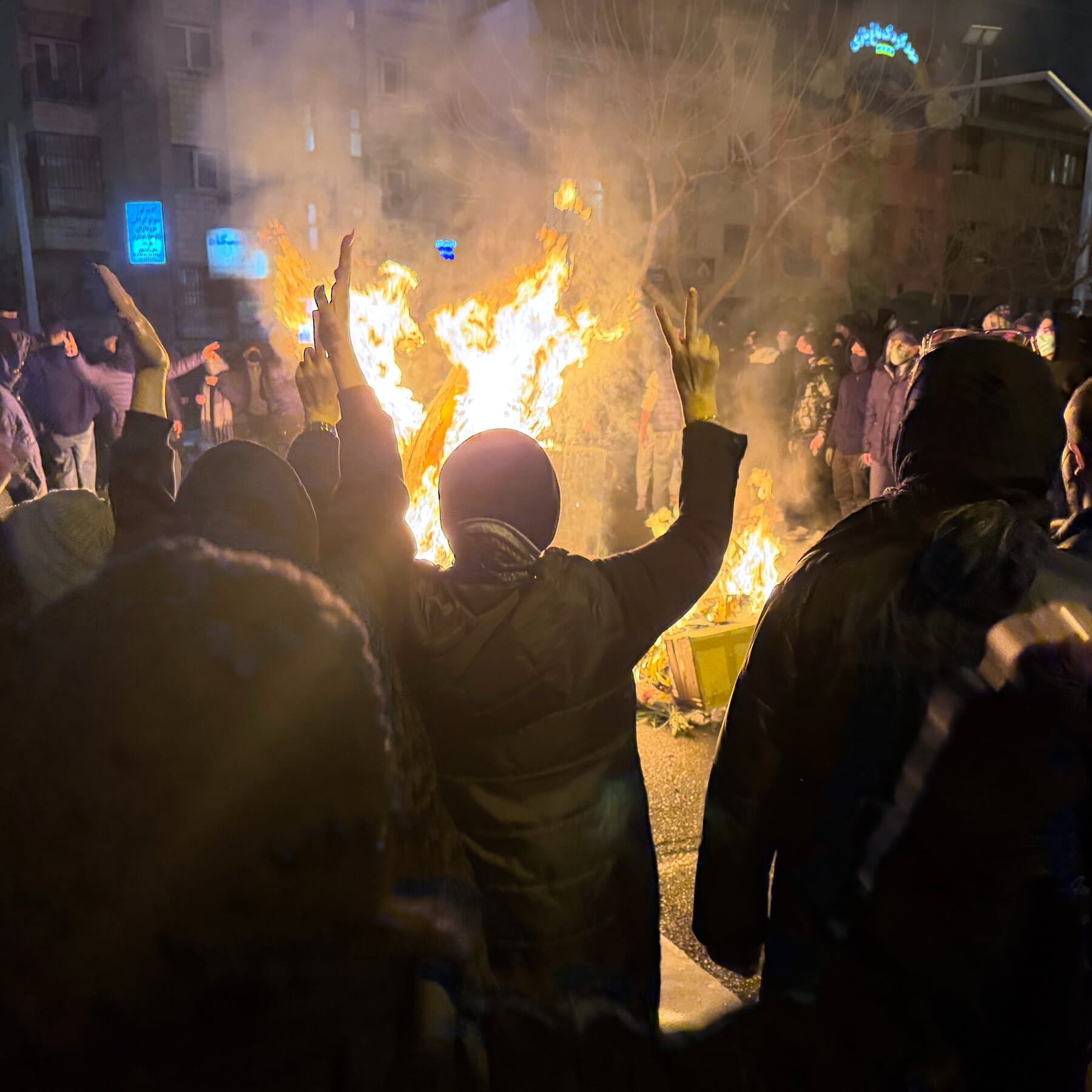 A satirical news photo of three elderly billionaires in business suits and puffy vests standing on a luxury hotel balcony in the snowy Swiss Alps. They are holding flutes of champagne and looking with feigned concern at a hologram of the Earth which is visibly on fire. High contrast, realistic style.