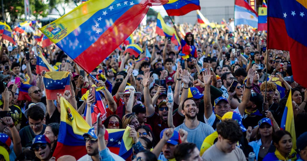 A satirical illustration of a giant, orange-haired bulldozer with a suit and tie, being cheered on by a crowd of desperate people as it drives toward a crumbling, socialist-style palace. The background shows a landscape of empty grocery stores and broken statues of revolutionaries, all in a high-contrast, cynical editorial cartoon style.