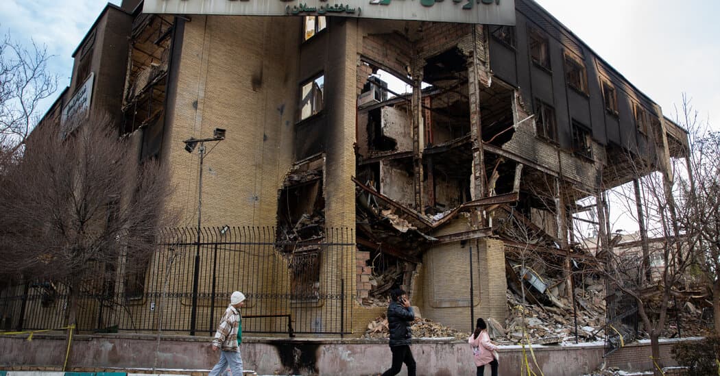 A hyper-realistic, dark satirical image of a giant, ancient stone gallows towering over a silent, empty Iranian street. The shadows of the gallows are shaped like a skeletal hand gripping a throat. In the background, a faint, glowing neon sign of a hashtag '#Solidarity' is flickering and half-broken on a dilapidated building under a smog-choked sky.