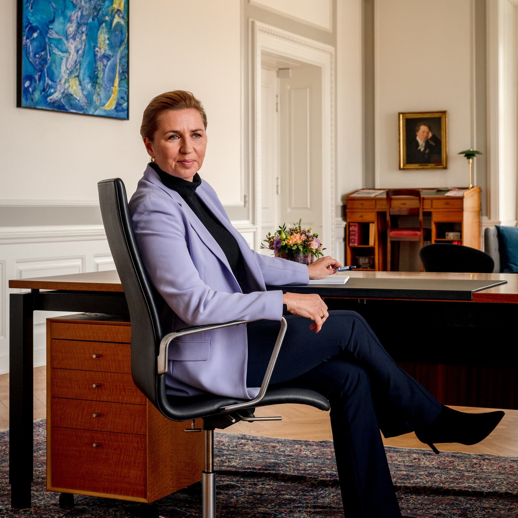 A conceptual illustration of a Monopoly board game where the property spaces are maps of European countries, with a large, golden 'For Sale' sign stuck into a snowy Greenland, while a small Danish flag waves weakly in the wind against a dark, stormy sky.