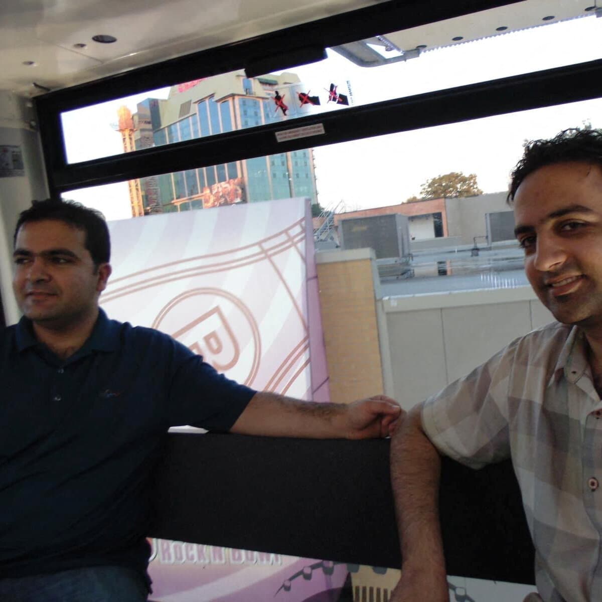 A single, empty chair sitting in the middle of a dusty, shadowed concrete room in Kabul. The lighting is harsh and dim, coming from a small barred window high up. The atmosphere is cold, abandoned, and hopeless. No people, just the emptiness where a person should be. High contrast, gritty texture.