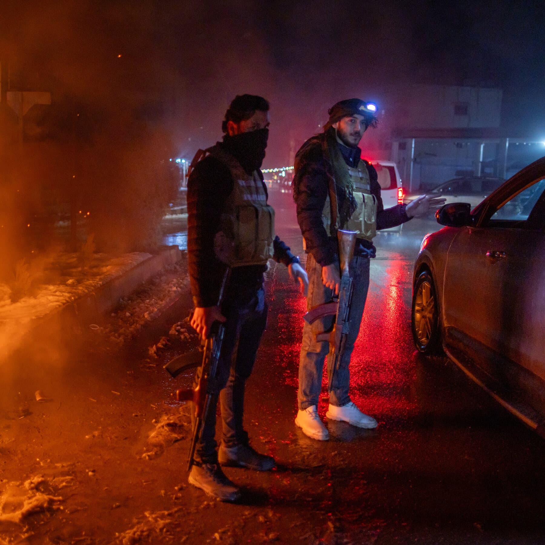 A gritty, cynical illustration of two military uniforms sewn together with crude, messy stitches. One half is a standard government olive drab, the other is a militia camouflage. In the background, a blurred figure in a suit watches from a high balcony. The style should be dark, muted colors, resembling a political cartoon sketched on a dirty napkin.