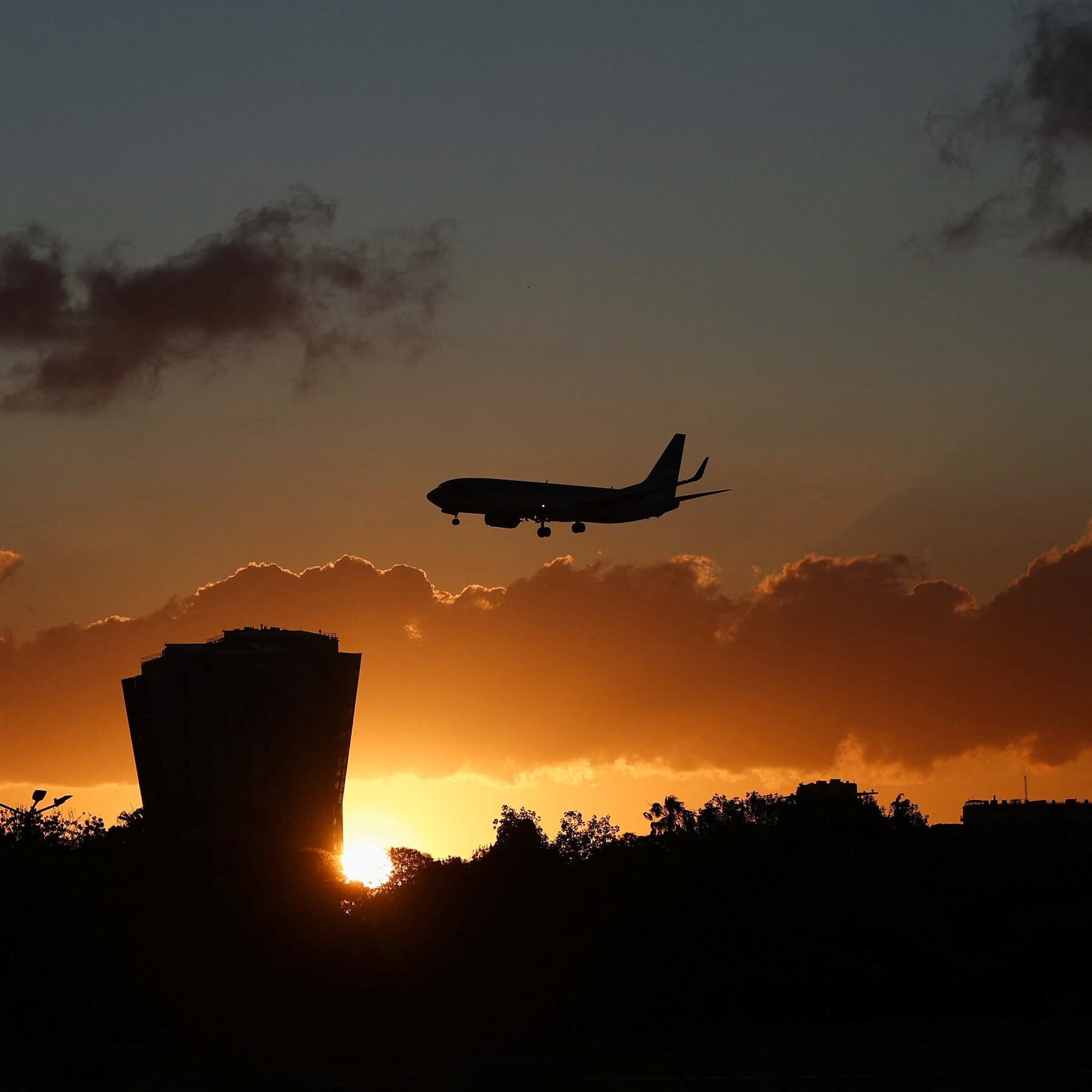A surreal, gritty political cartoon style illustration showing a giant, rusty pipe extending from a map of the United States down to a map of Argentina. The pipe is leaking. In Argentina, a man in a suit with wild hair is catching the drops in a bucket while standing in a desolate landscape. Muted colors, scratchy texture, cynical atmosphere.
