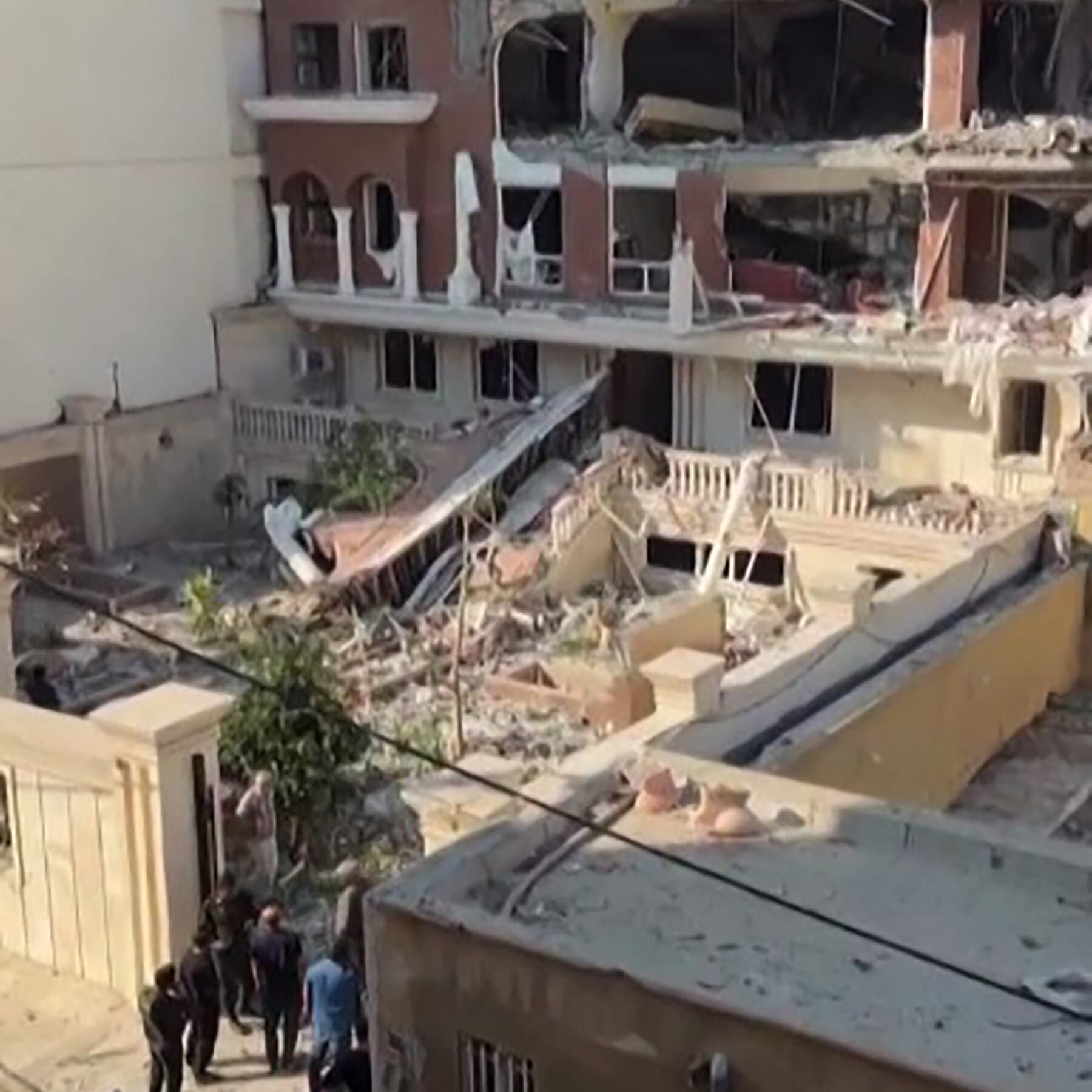 A cracked, rusted teapot sitting on a stove, releasing steam that forms the shape of a small mushroom cloud. The lighting is dark and moody, cinematic style. The background is a blurry, shadowy kitchen that looks like a bunker.