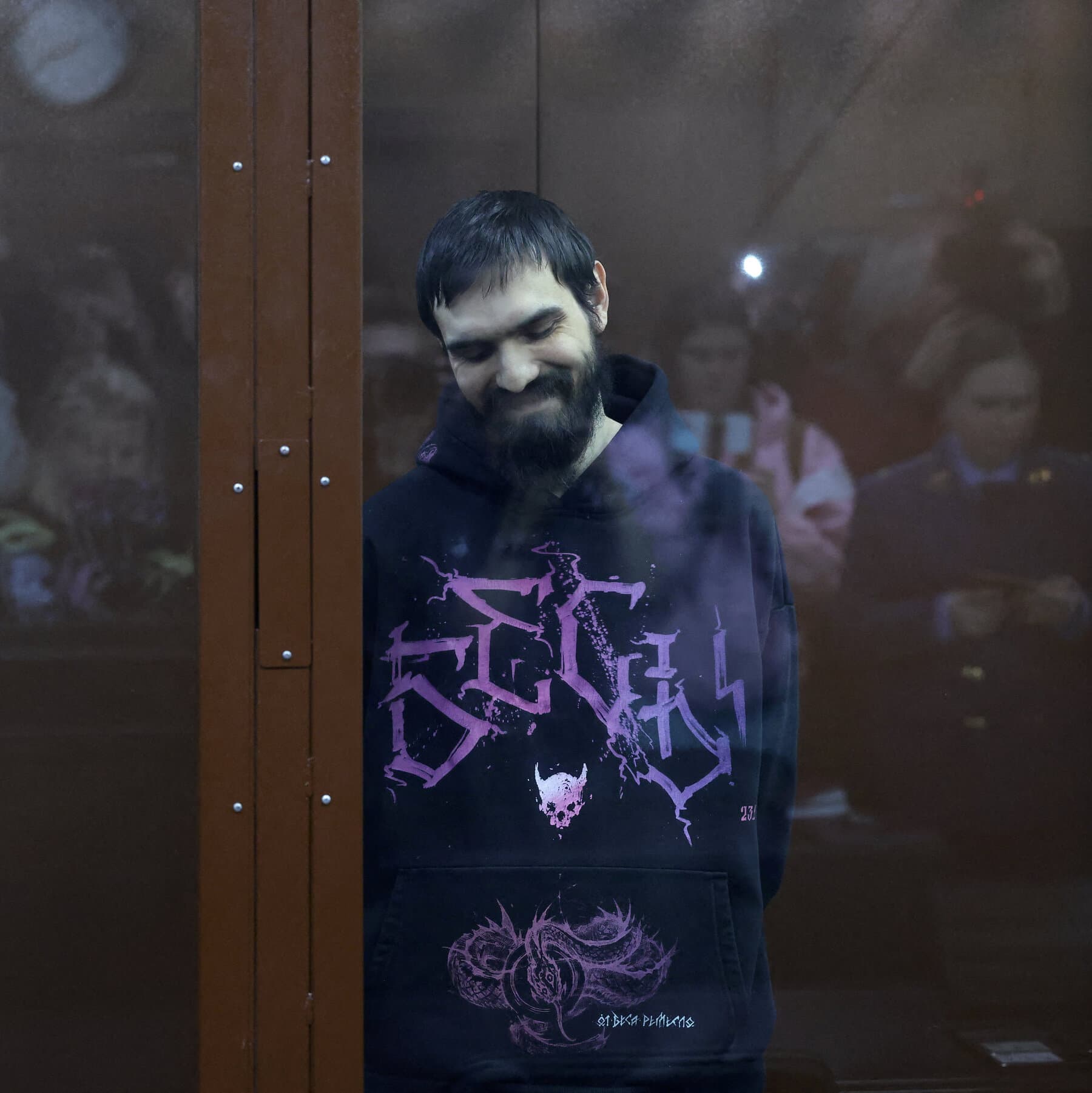 A single, rusty microphone standing in the center of a cold, grey prison cell. A spotlight hits the microphone, casting a long shadow that looks like prison bars. The style is gritty, realistic, and depressing.