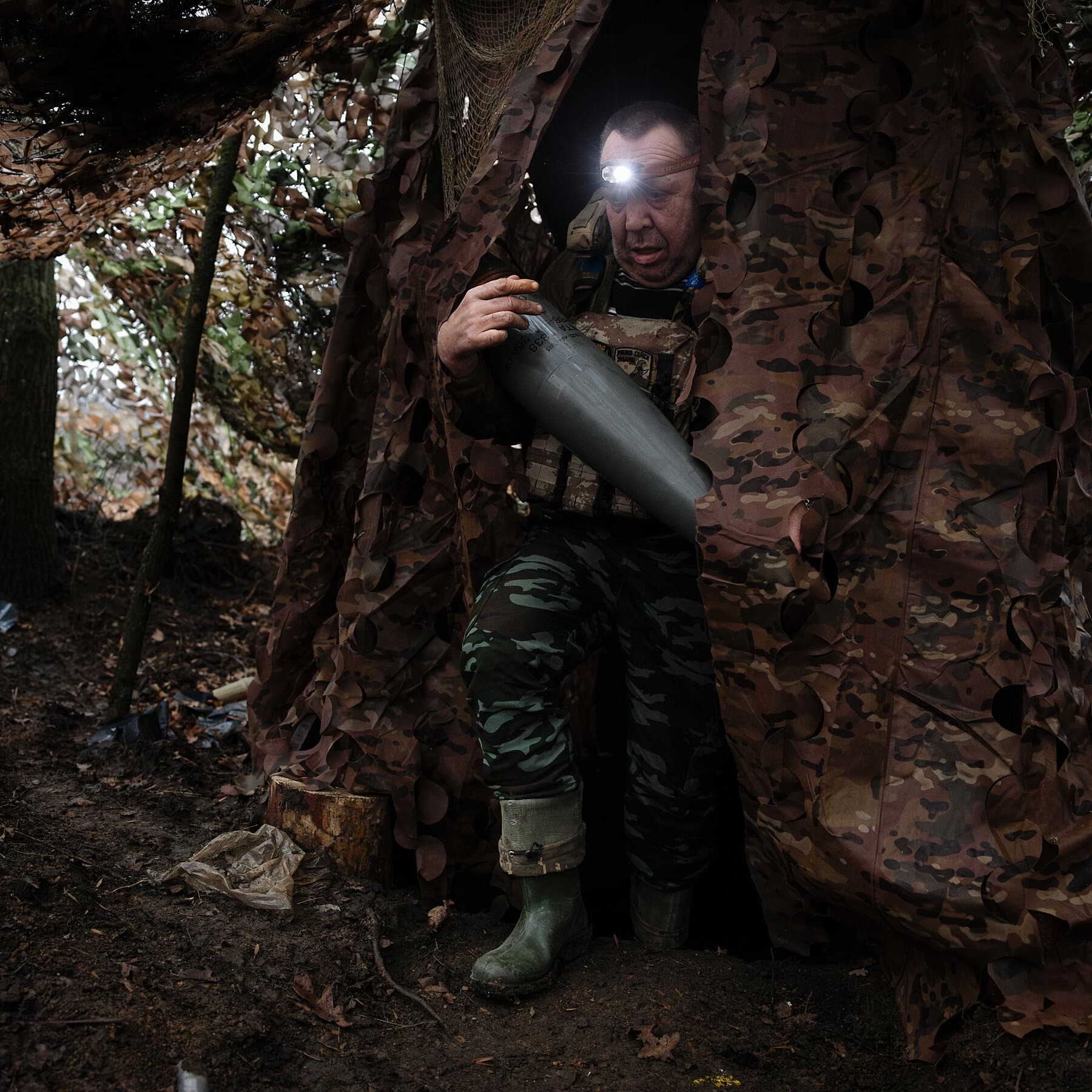 A gritty, cynical illustration of a torn map lying in the mud, with a fancy fountain pen resting on top of it. The map shows blurry borders. The lighting is grey and overcast. No humans, just the abandoned objects of a failed negotiation.