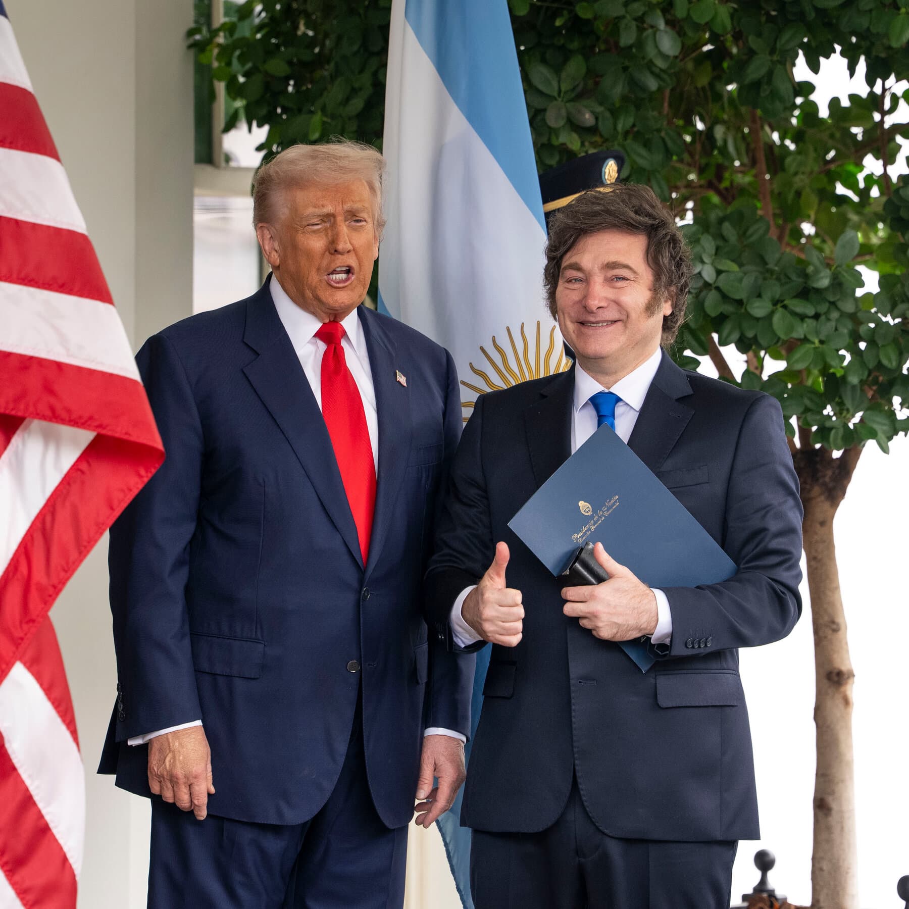 A surreal, cynical political cartoon style illustration. A large, confused cow wearing a tuxedo sits at a formal negotiation table. Opposite the cow is a bald eagle in a business suit, looking stressed. They are signing a document with a quill pen. The room is dimly lit, smoky, and filled with stacks of paperwork. The atmosphere is tense and absurd.