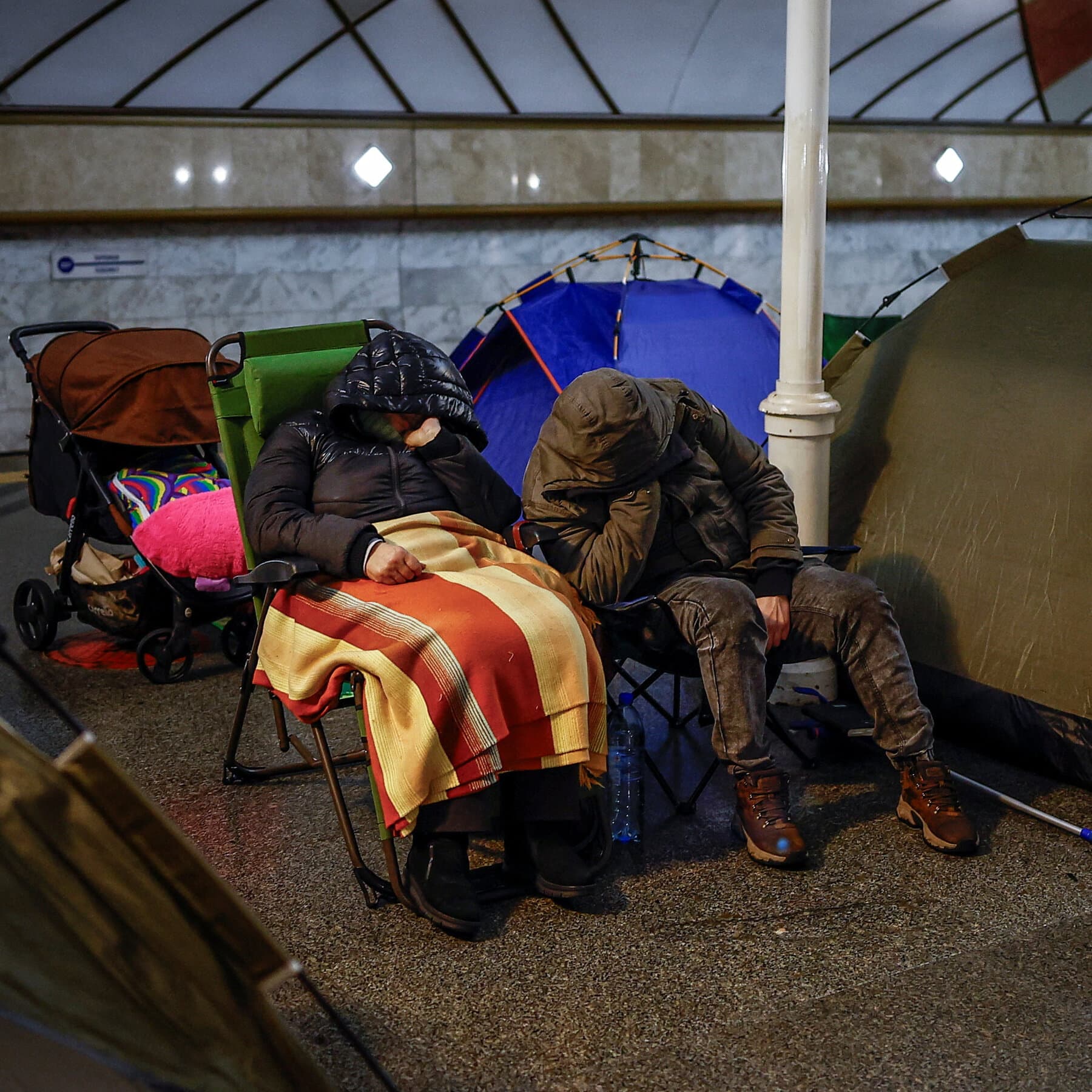A gritty, high-contrast black and white illustration of a frozen city skyline at night, no lights in the windows, with a single broken power line sparking against the snow. Gloomy, cynical atmosphere.