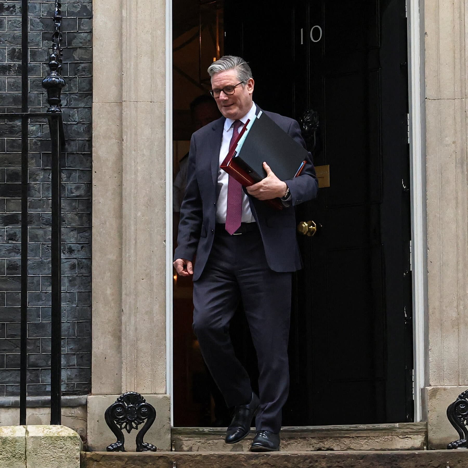 A gritty, dimly lit political backroom where a group of people in expensive suits are patting a worried man on the back while secretly holding knives behind their own backs. The atmosphere is smoky and tense. The style should be dark, cynical realism.