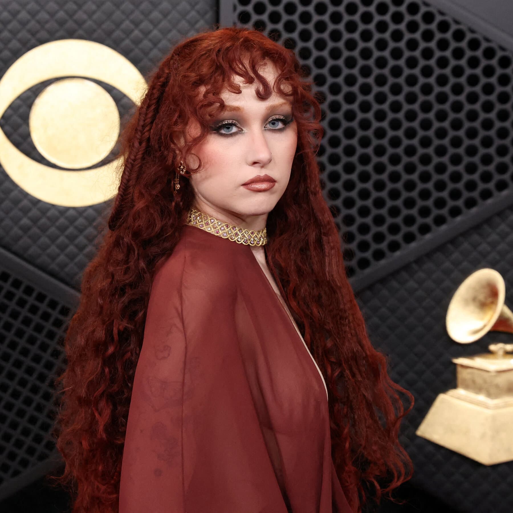 A single, empty spotlight shining on a dusty stage, with a shadowy, faceless figure in a suit standing in the darkness of the background, high contrast, noir style, gloomy atmosphere.