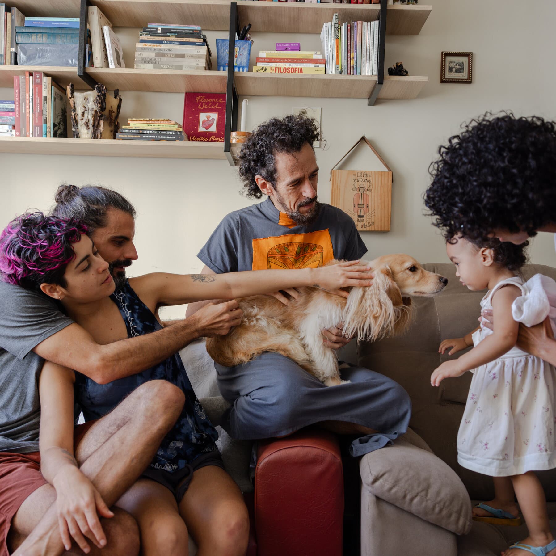 A single, worn-out leather armchair sitting alone in a room filled with three different styles of messy, modern furniture, under the shadow of a large window overlooking Rio de Janeiro, high contrast, moody lighting.