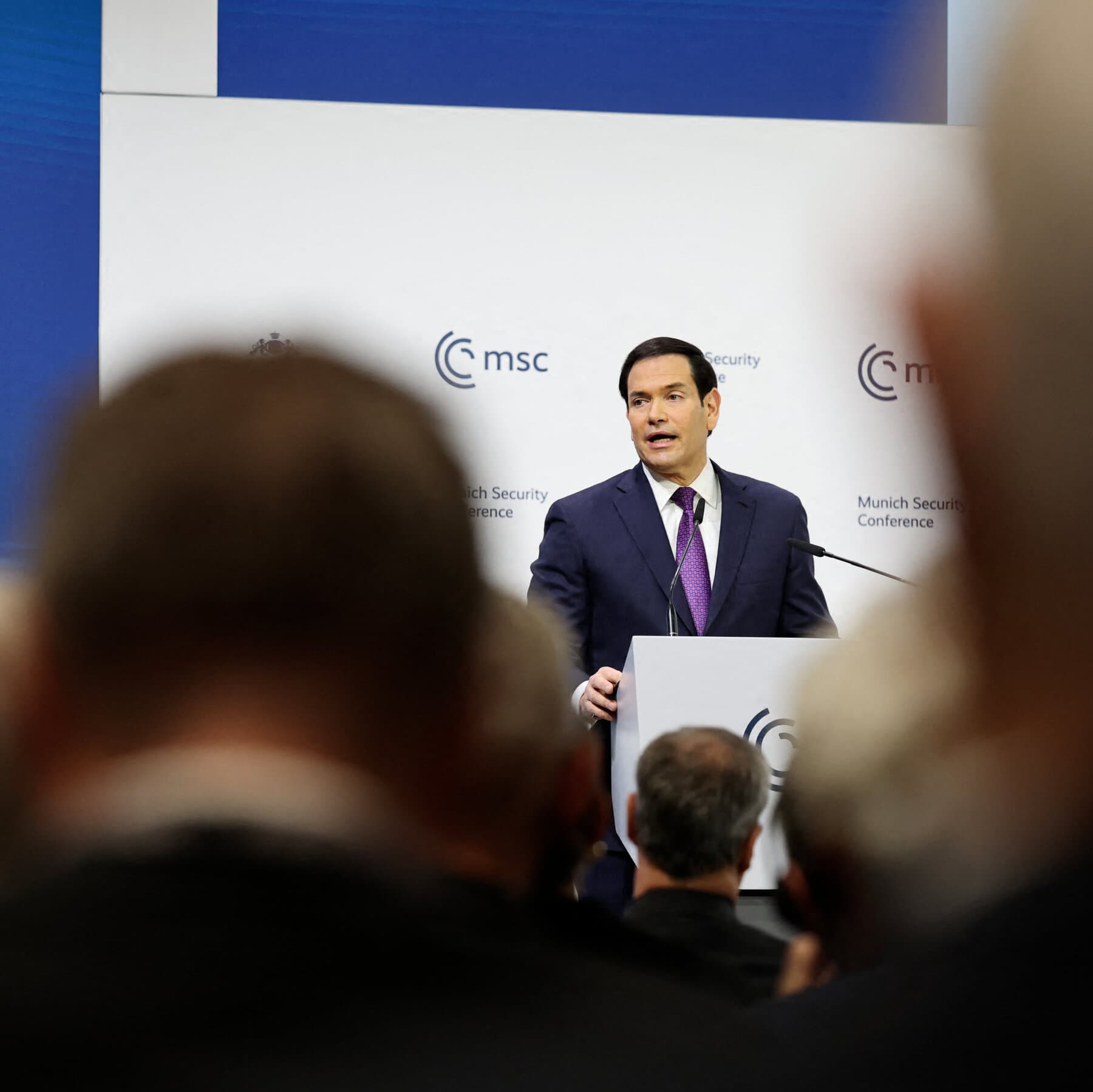 A conceptual illustration showing a split scene. On the left, a glowing, idealized vision of a medieval European knight or cathedral representing the American fantasy. On the right, a grey, boring meeting room filled with modern bureaucrats looking at their phones and drinking coffee, representing the European reality. The lighting on the right should be flat and fluorescent.