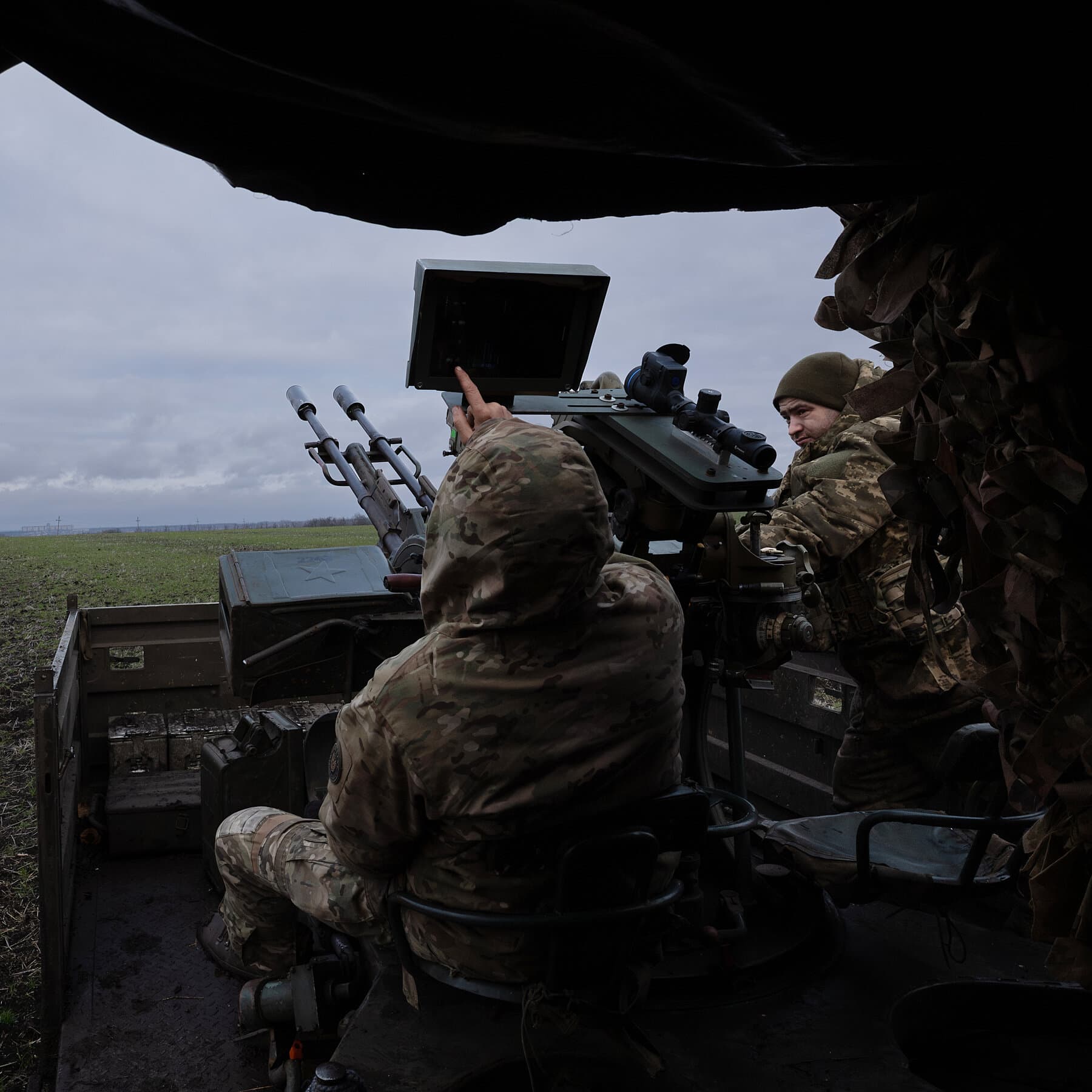 A high-contrast, gritty illustration of two business suits sitting at a pristine, polished table. Between them on the table sits a pile of smoking grey rubble and broken concrete instead of a map. The figures are faceless. The background is dark and shadowy. The style should be cynical political cartoon meets noir realism.