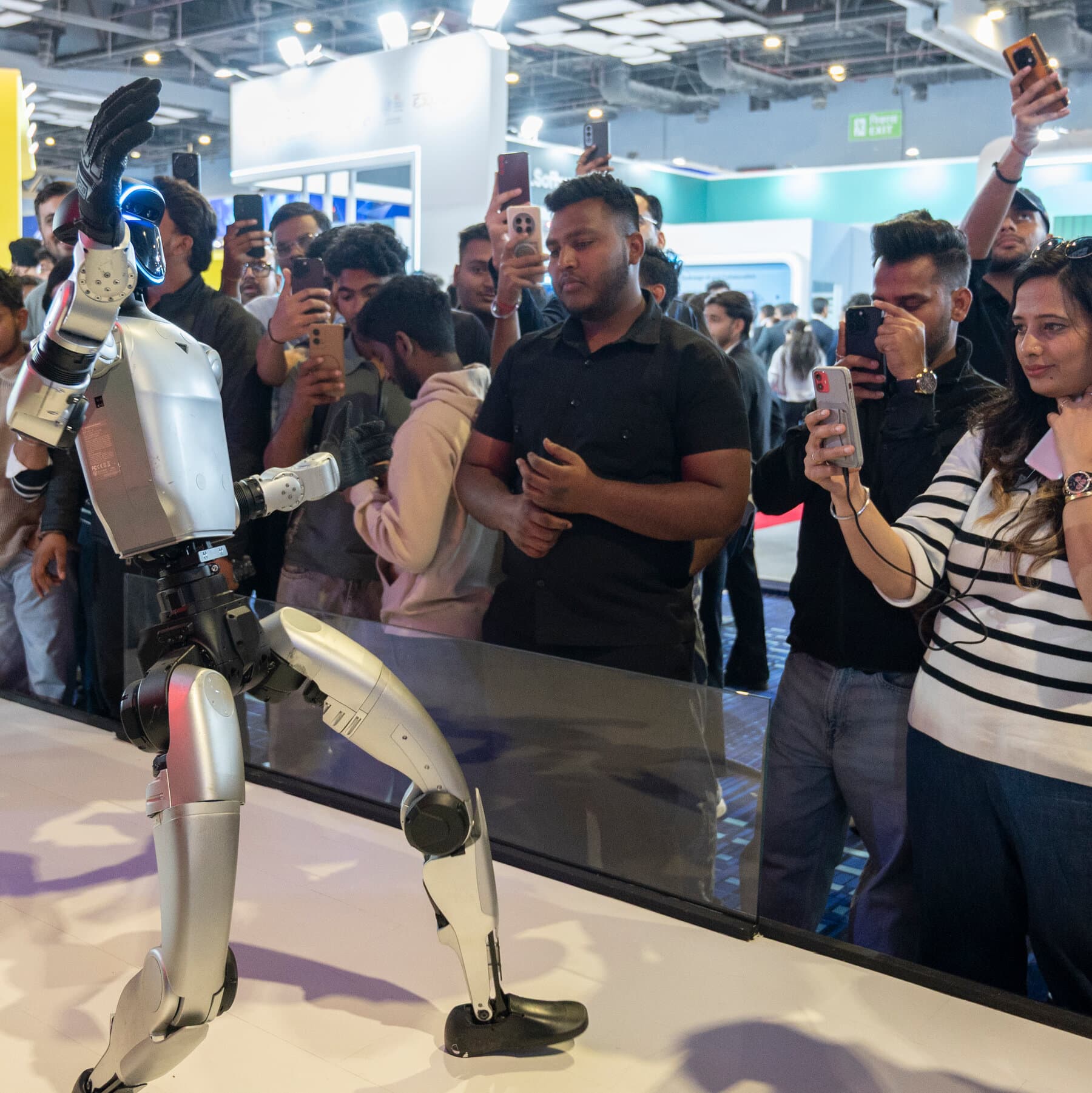 A cynical, dark political cartoon style illustration showing three hands grabbing a glowing computer chip. One hand has a US flag cuff, one has a China flag cuff, and the third has an India flag cuff. The background is a smoky, dimly lit backroom.
