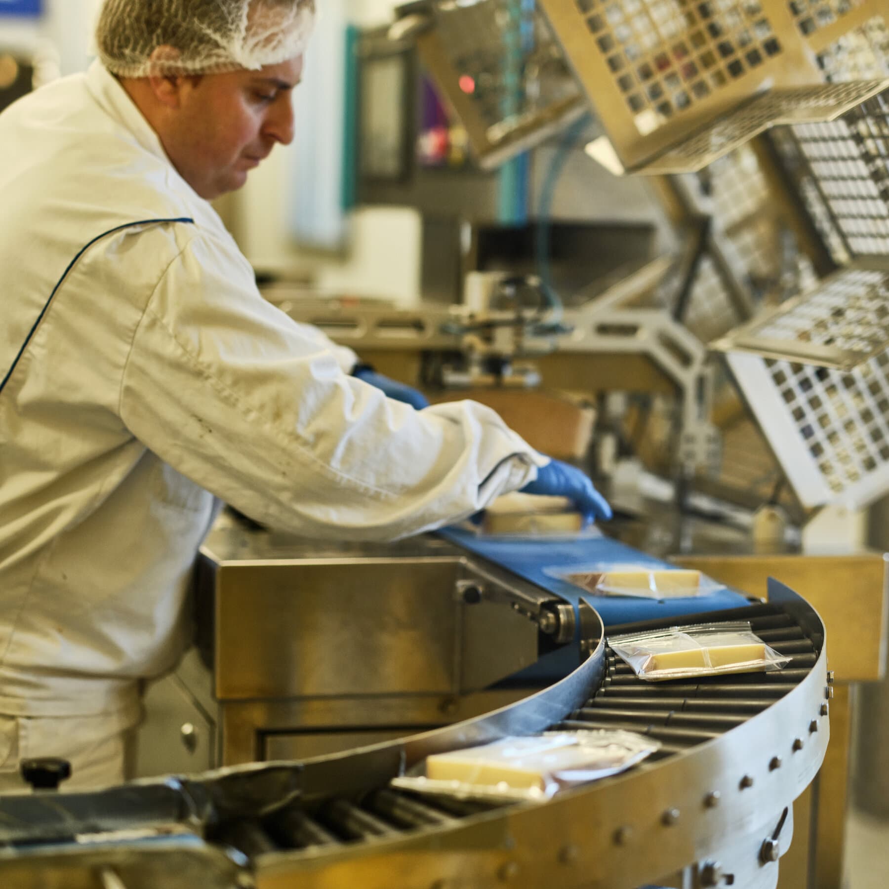 A hyper-realistic, cynical editorial illustration of a European bureaucrat in a gray suit staring nervously at a large, red 'PAUSE' button on a desk. The background is a foggy, chaotic blur of American and European flags tangled together. The lighting is dim and moody, reflecting a sense of stagnation and bureaucratic boredom.