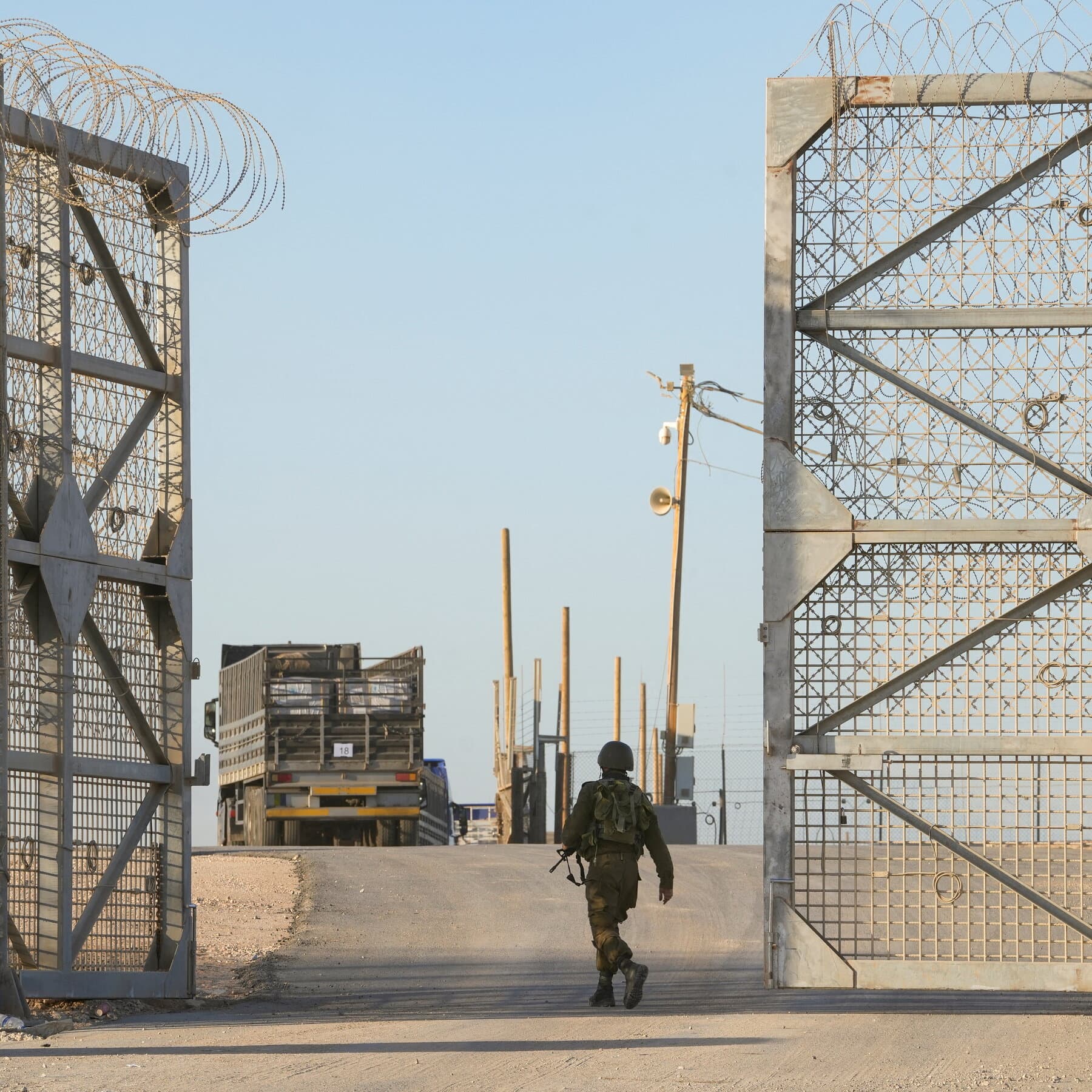 A gritty, noir-style illustration of a faceless intelligence agent in a trench coat exchanging a brown paper bag for cash through a chain-link fence, bleak grey and muted colors, high contrast.