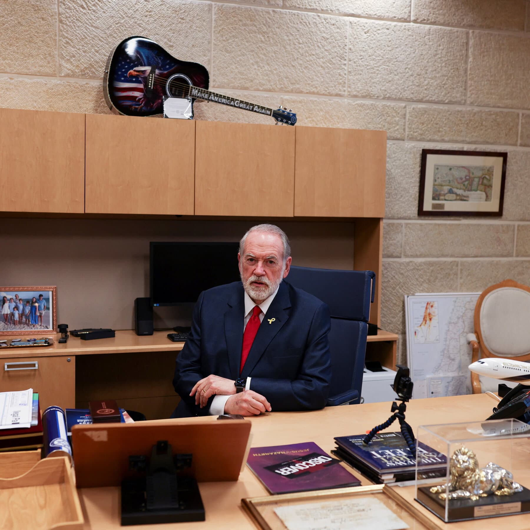 A single, hastily packed suitcase sitting open on a polished mahogany desk in a dimly lit office, with a wall calendar in the background marked with a red circle on the current date, moody noir atmosphere, 4k resolution.