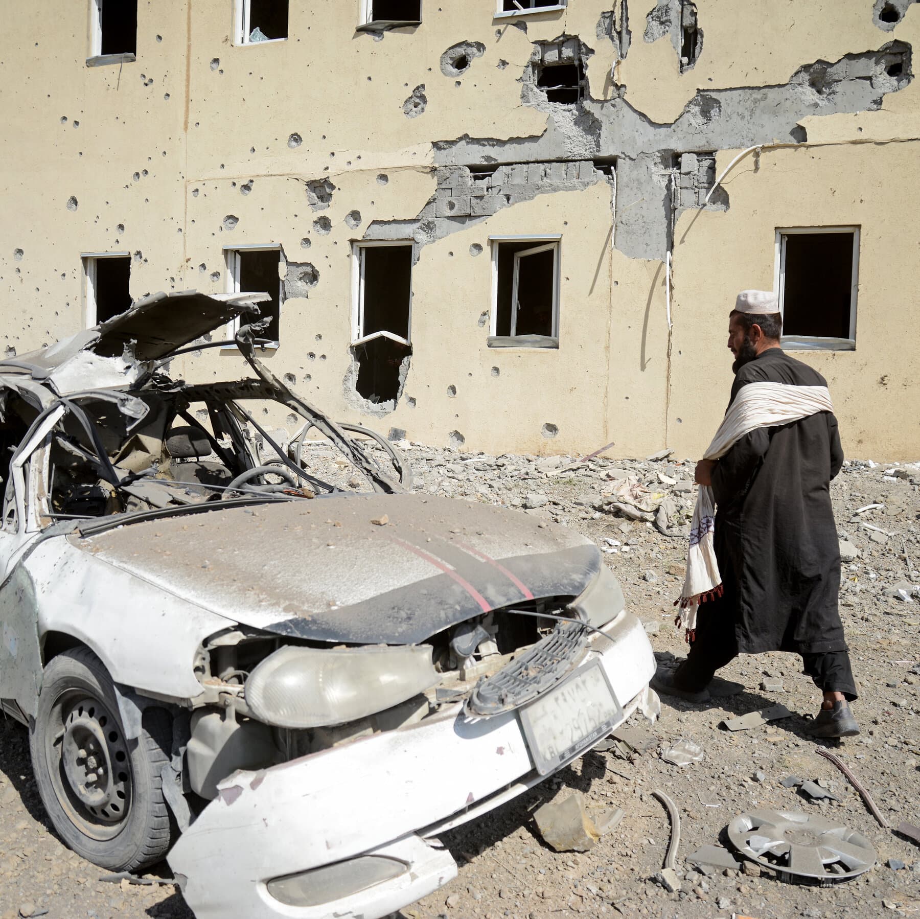 A gritty, high-contrast illustration of a modern fighter jet flying high above a desolate, rocky mountain landscape, while a shadowy figure hides in a cave below holding an old rifle. The style should be dark and cynical.