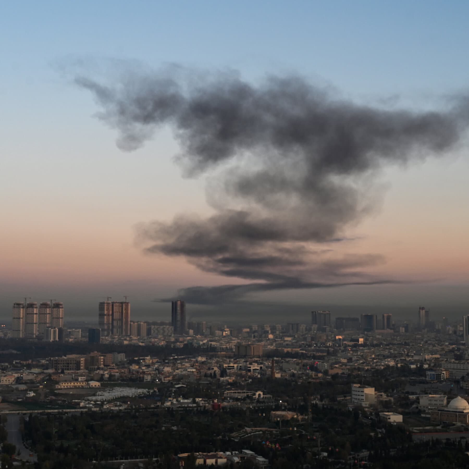 A hyper-realistic, cynical editorial illustration showing a pristine, polished mahogany desk in the Oval Office covered in toy soldiers and a spilled cup of coffee. In the background, a blurred map of Iran hangs on the wall, slightly crooked. The lighting is dim and moody, emphasizing the mess on the desk. No people are visible, only the aftermath of poor planning.