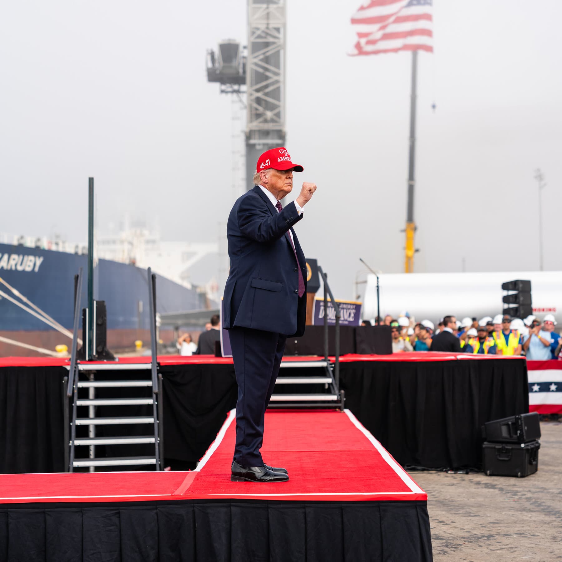 A rusted metal road sign that says 'CAUTION' lying in the dirt, being crushed by the heavy metal tread of a modern military tank, hyper-realistic style, gloomy and dusty atmosphere.