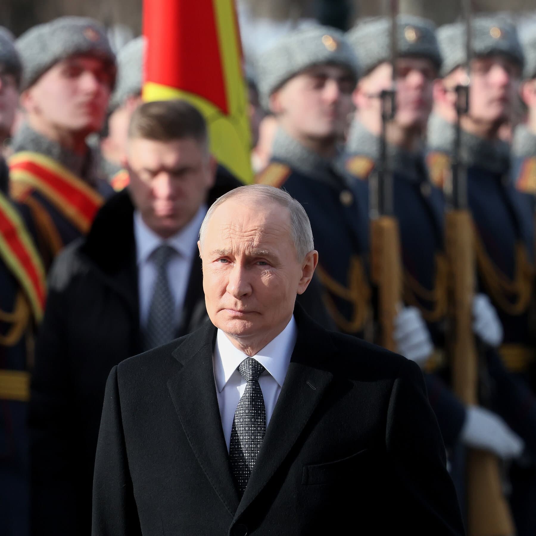 A satirical illustration showing a small, tired-looking Vladimir Putin holding a broken chess piece, standing in the shadow of a giant, loud, neon-lit stage where a silhouette of Trump is gesturing wildly. The background is a crumbling stone map of the world.