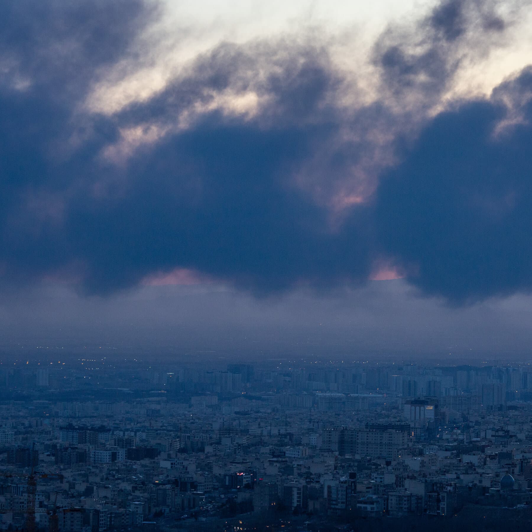 A conceptual illustration of a golden hourglass shattering on a table, the sand turning into black oil and gold coins, set against a dark, smoky background with a faint map of the Middle East, high contrast, cynical political art style.