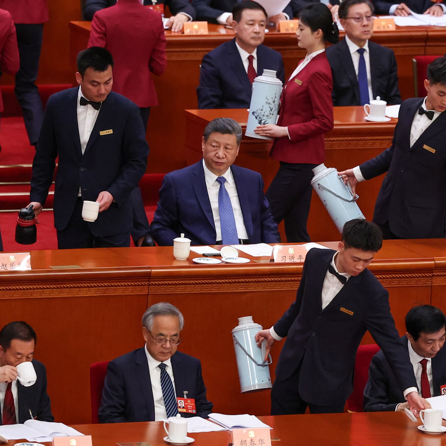 A gritty, high-contrast illustration of two giant, shadowy figures arm-wrestling over a small, burning globe. One figure wears a red tie, the other a dark suit. In the background, a pile of money is on fire. The style should be cynical and dark.
