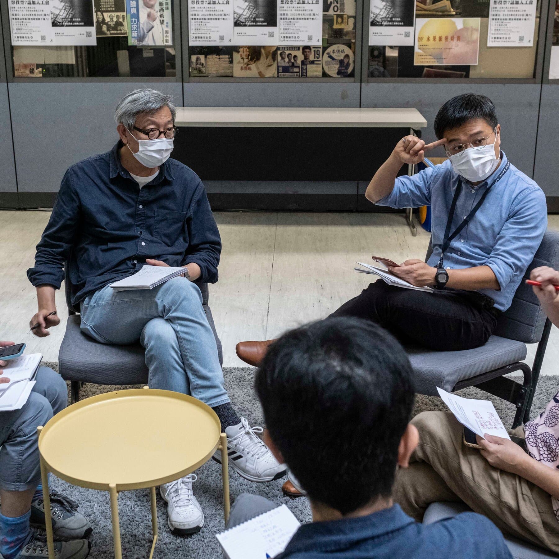 A gritty, noir-style illustration of a vintage typewriter sitting alone in a dark, empty concrete cell. The paper in the typewriter is blank. Long, heavy shadows of prison bars stretch across the floor. The lighting is dim and cold, with a muted color palette of greys and dark blues.