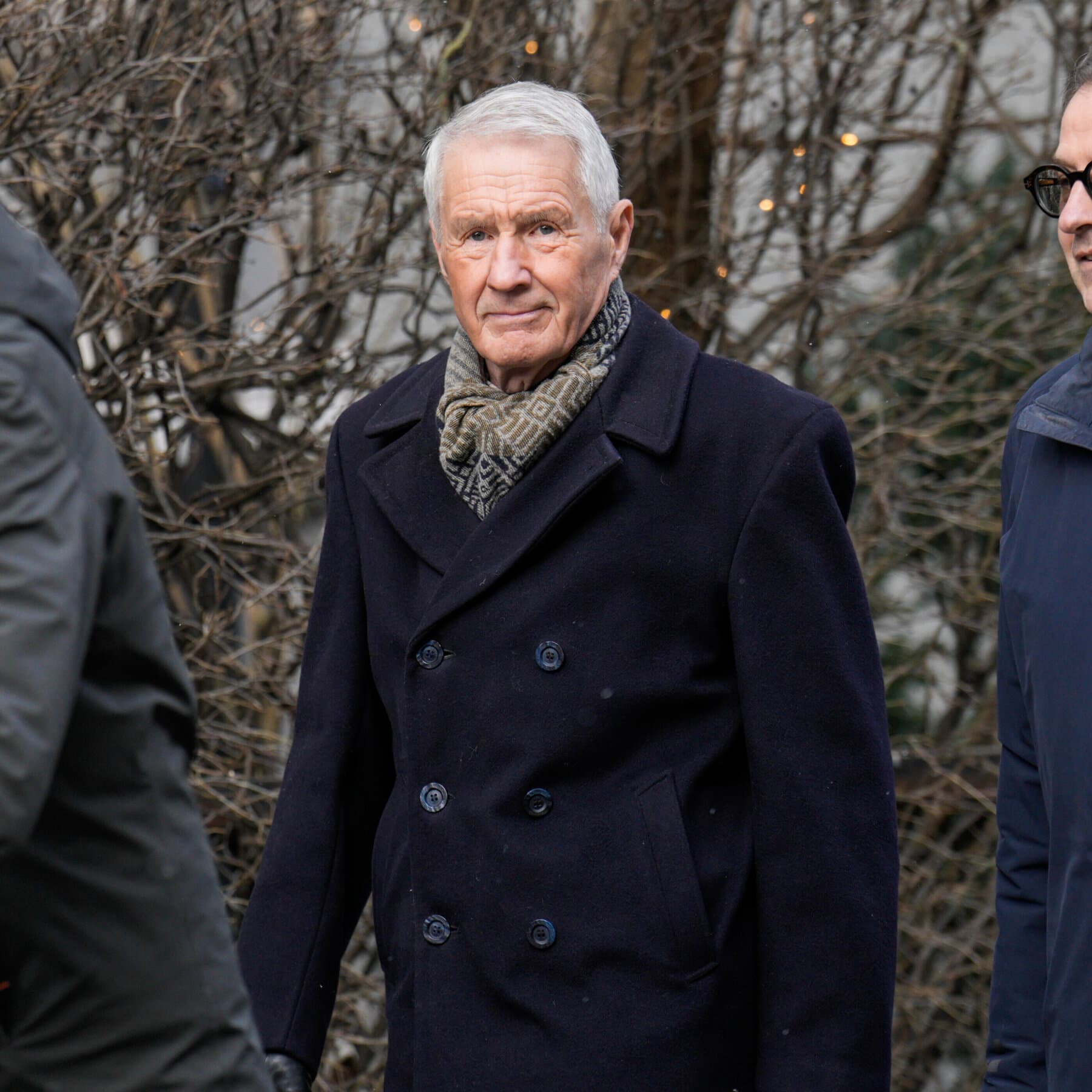 A single, pristine white snowflake resting on a jagged piece of dark, oily coal. The background is a blurry, cold grey steel texture. High contrast, moody lighting, photorealistic style.
